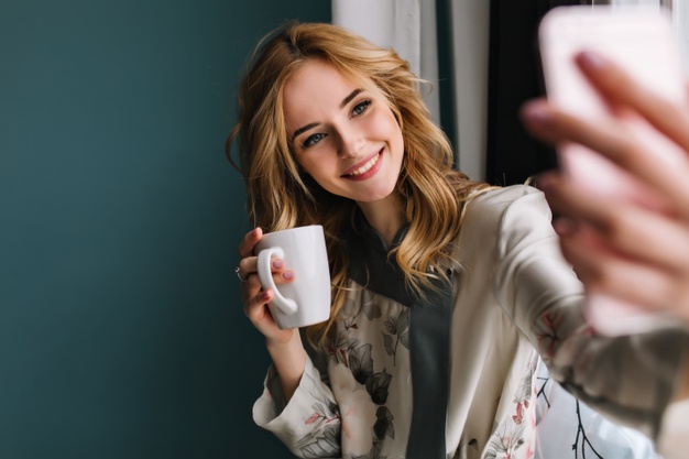 Young Women Taking Instagram Photos